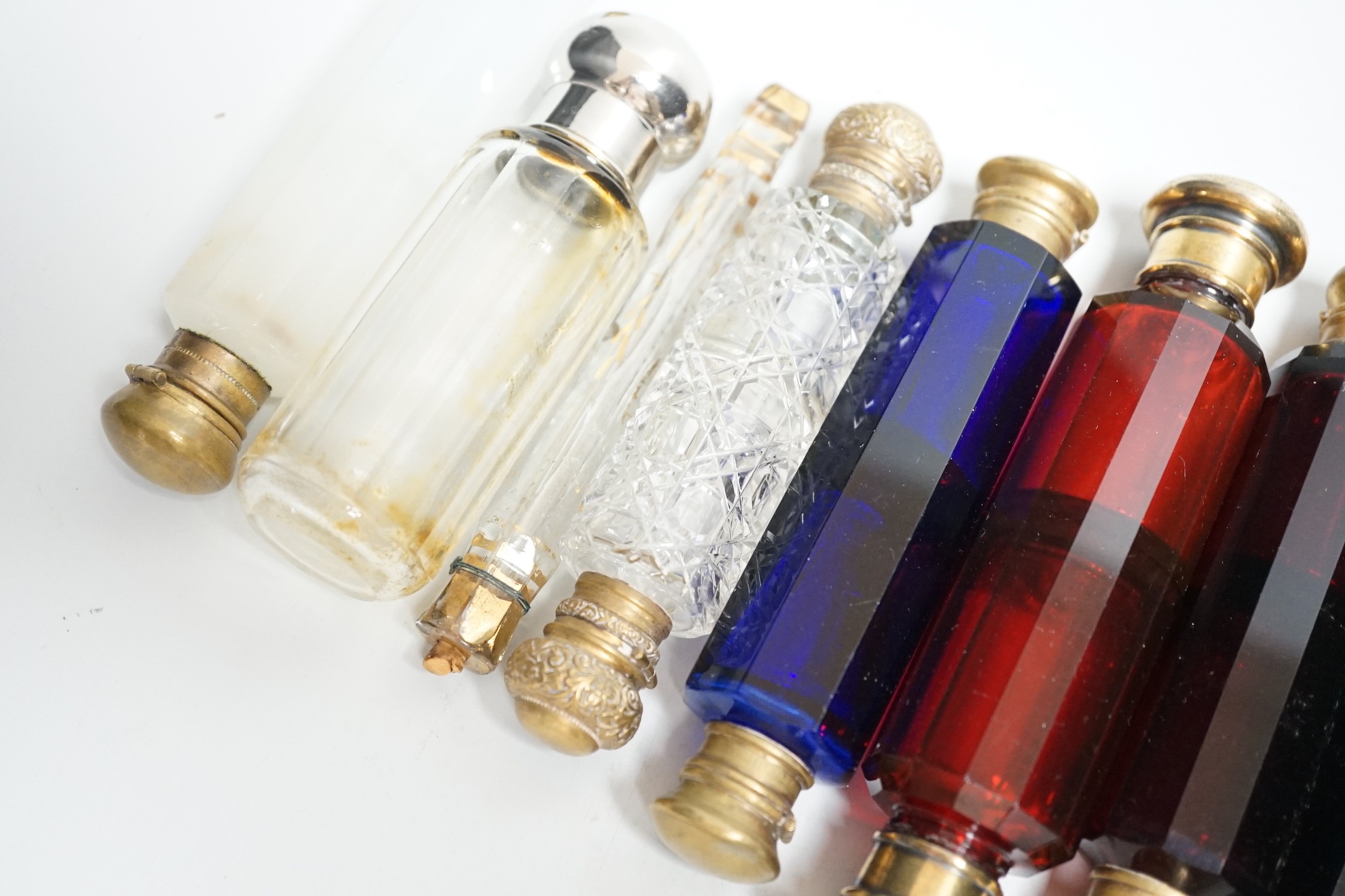 Seven 19th century coloured glass double ended scent bottles and three others